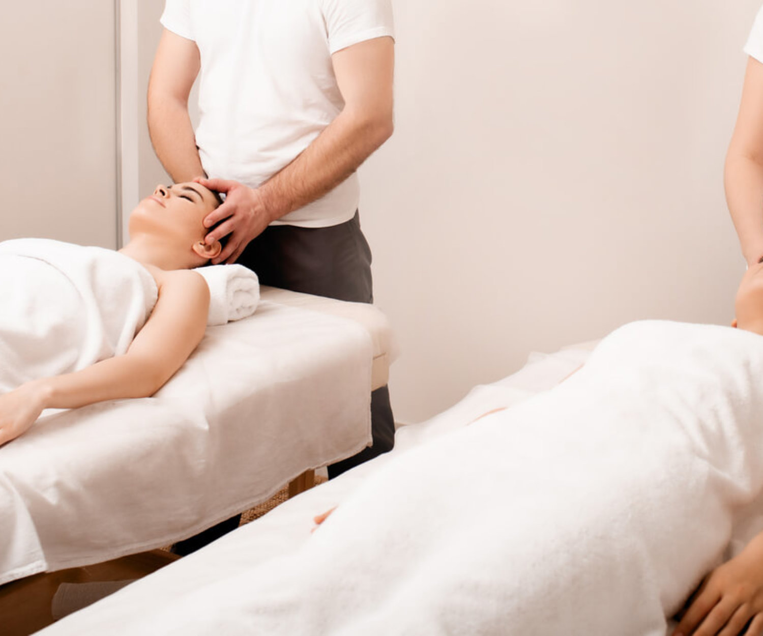Antistress relaxing head massage. Happy two asian women relaxing in spa center. Weekend spa for girlfriends